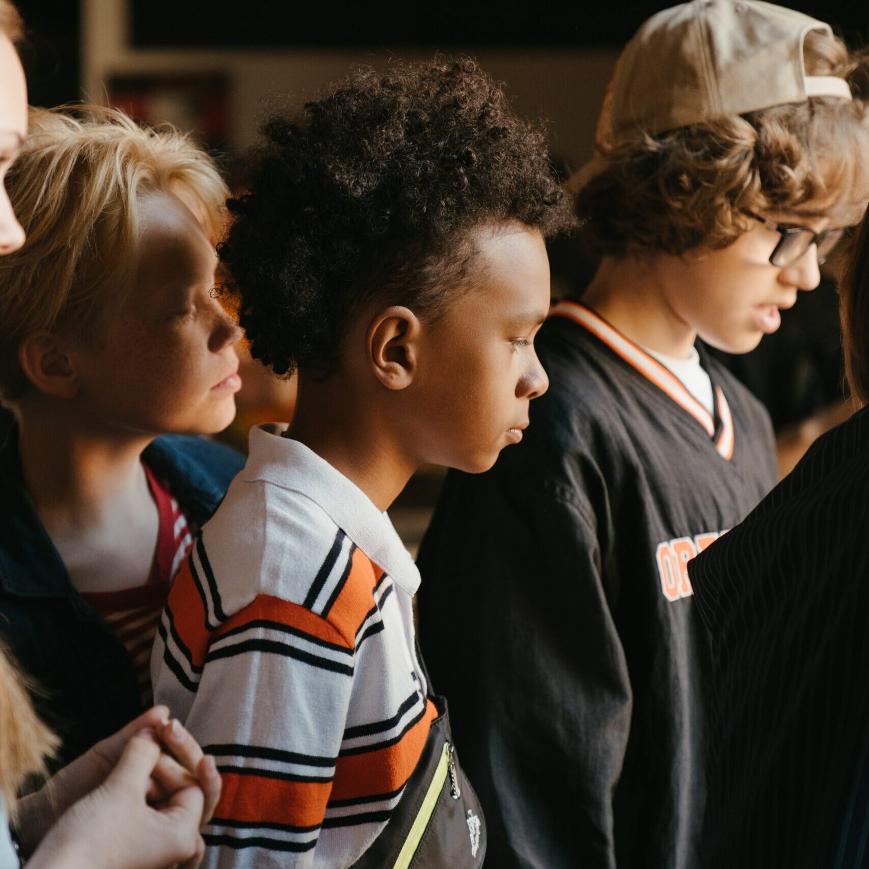 Youngster peering into something astonishing that has their attention but no one can see it but them.